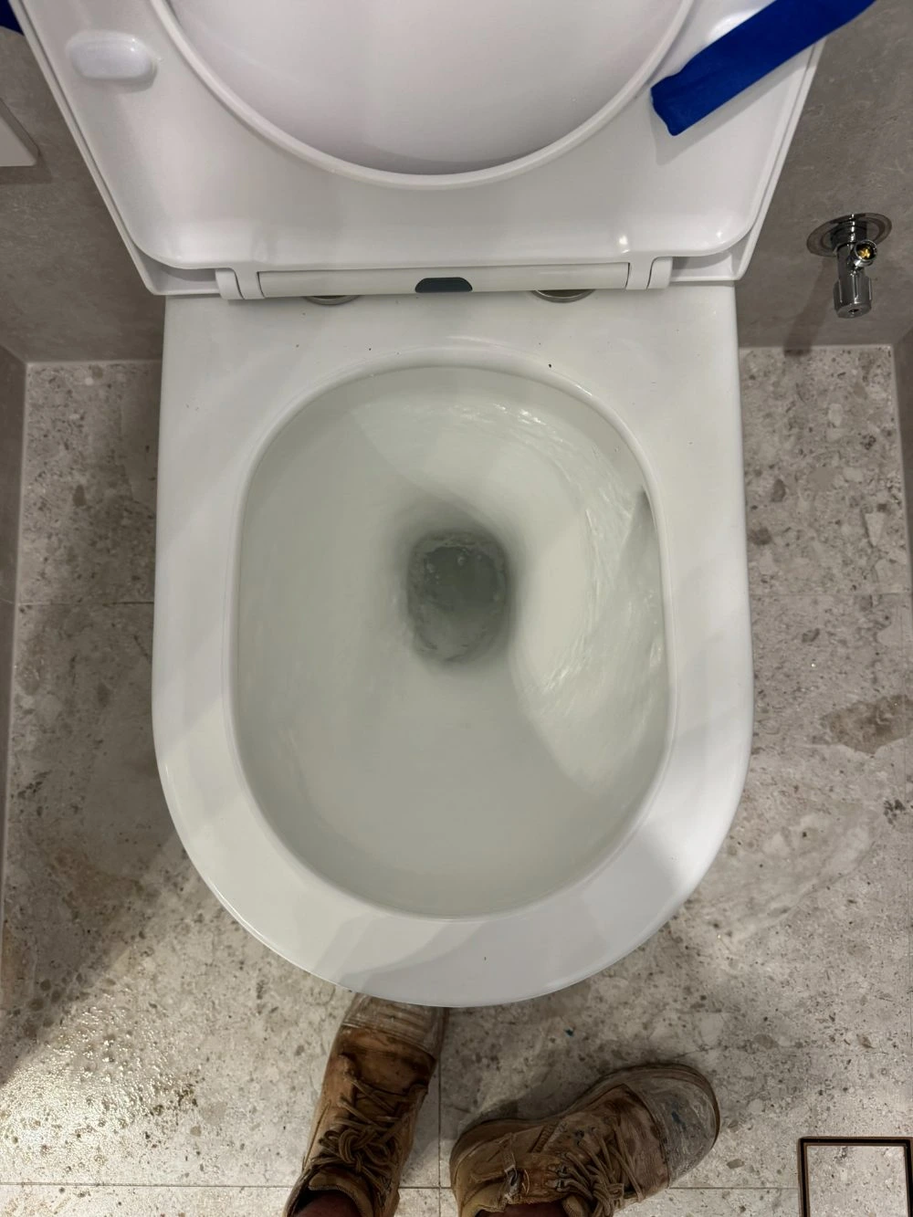 Tornado toilet flush spiralling water around the inside of the bowl