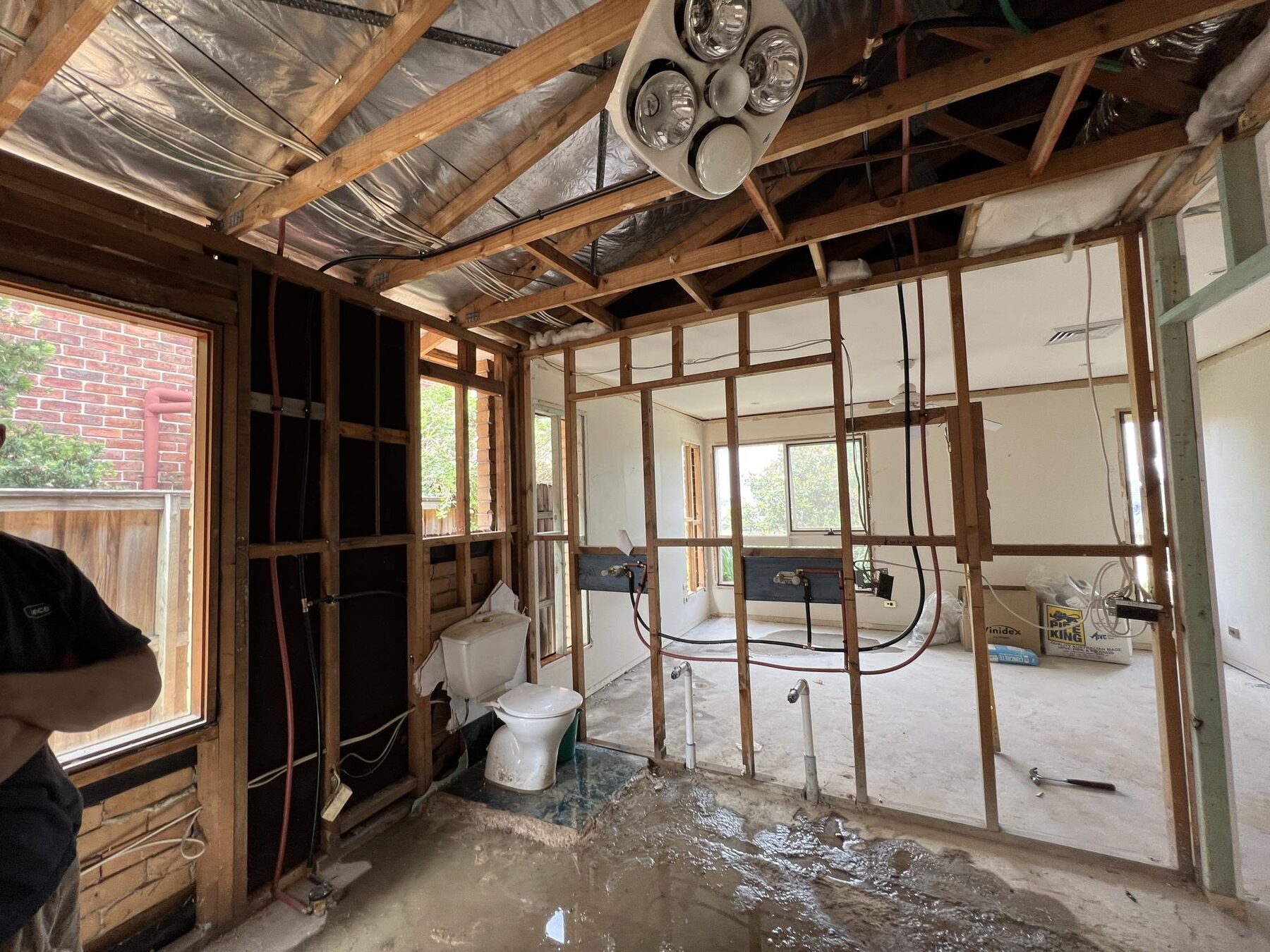 Bathroom renovation in progress, stripped back to the frame with new pipework