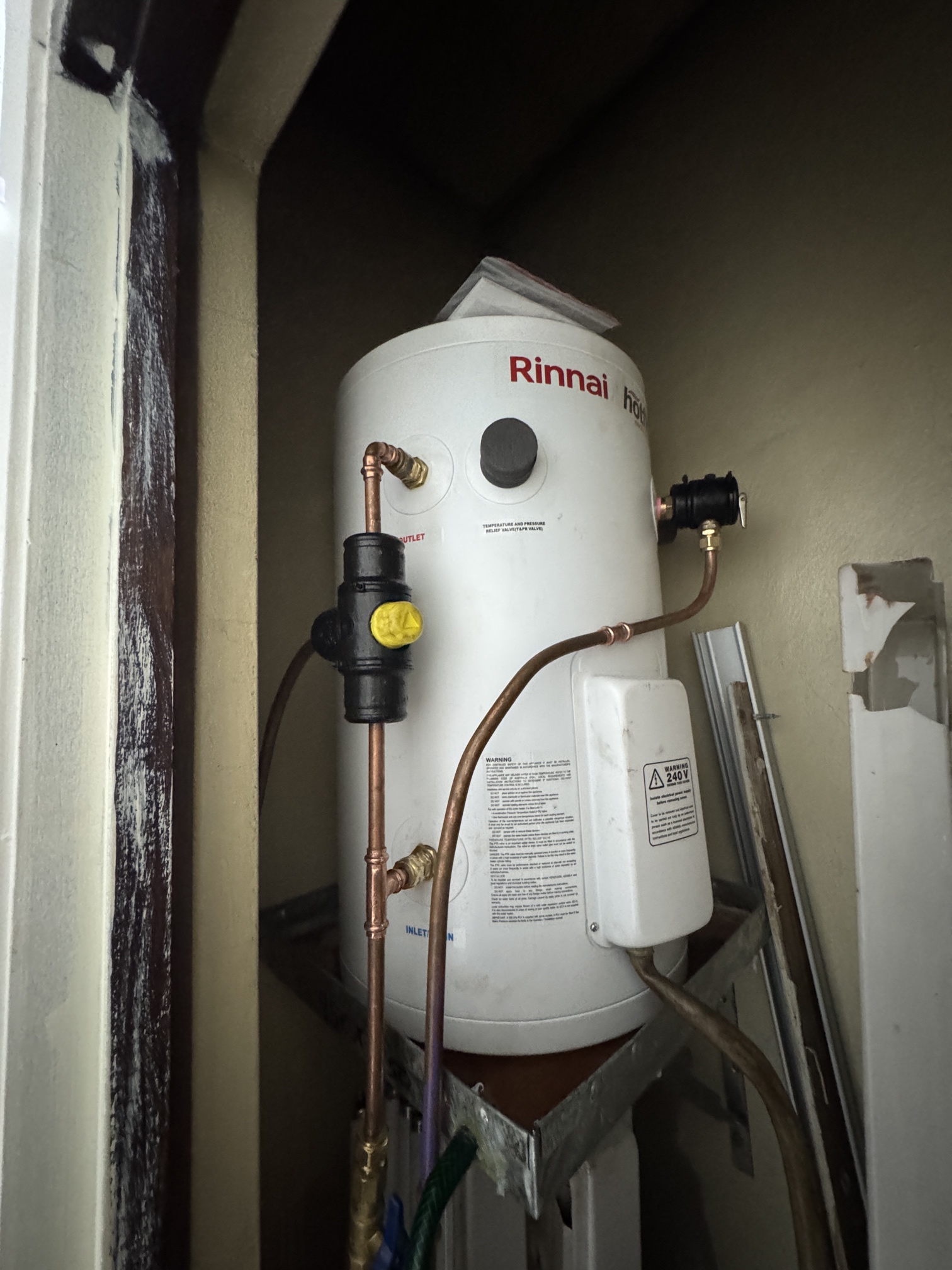 Rinnai electric hot water system installed in tight apartment cupboard in Wolli Creek