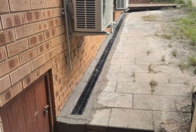 Strip drain installation down side of house in Arncliffe to stop water entering under the house
